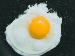 sunny side up egg on black plate